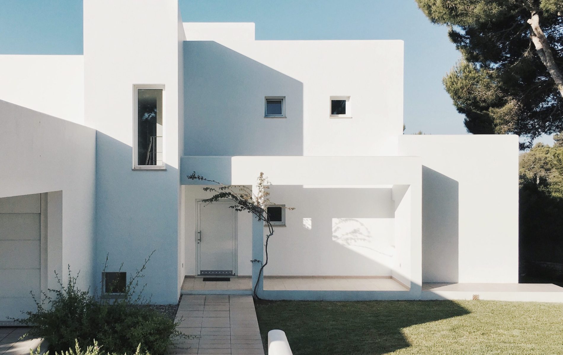 white double story house rendered in white.